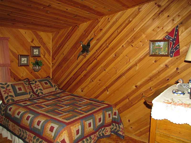 157 Cabin Road Normalville, PA 15469 - Photo 23 of 25 Bedroom. Knotty pine walls are throughout the home!