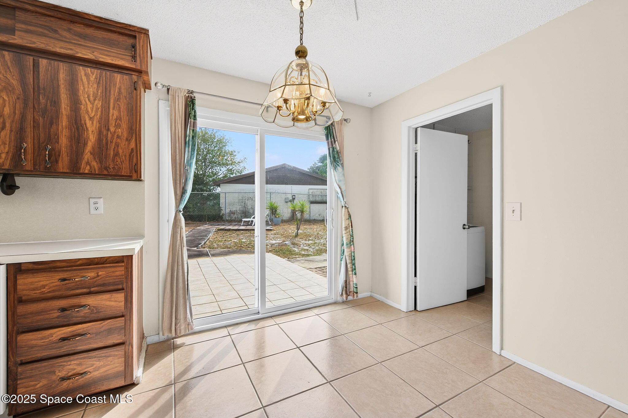 2135 Otterbein Avenue Cocoa, FL 32926 - Photo 12 of 28 a view of a room with a flat screen tv