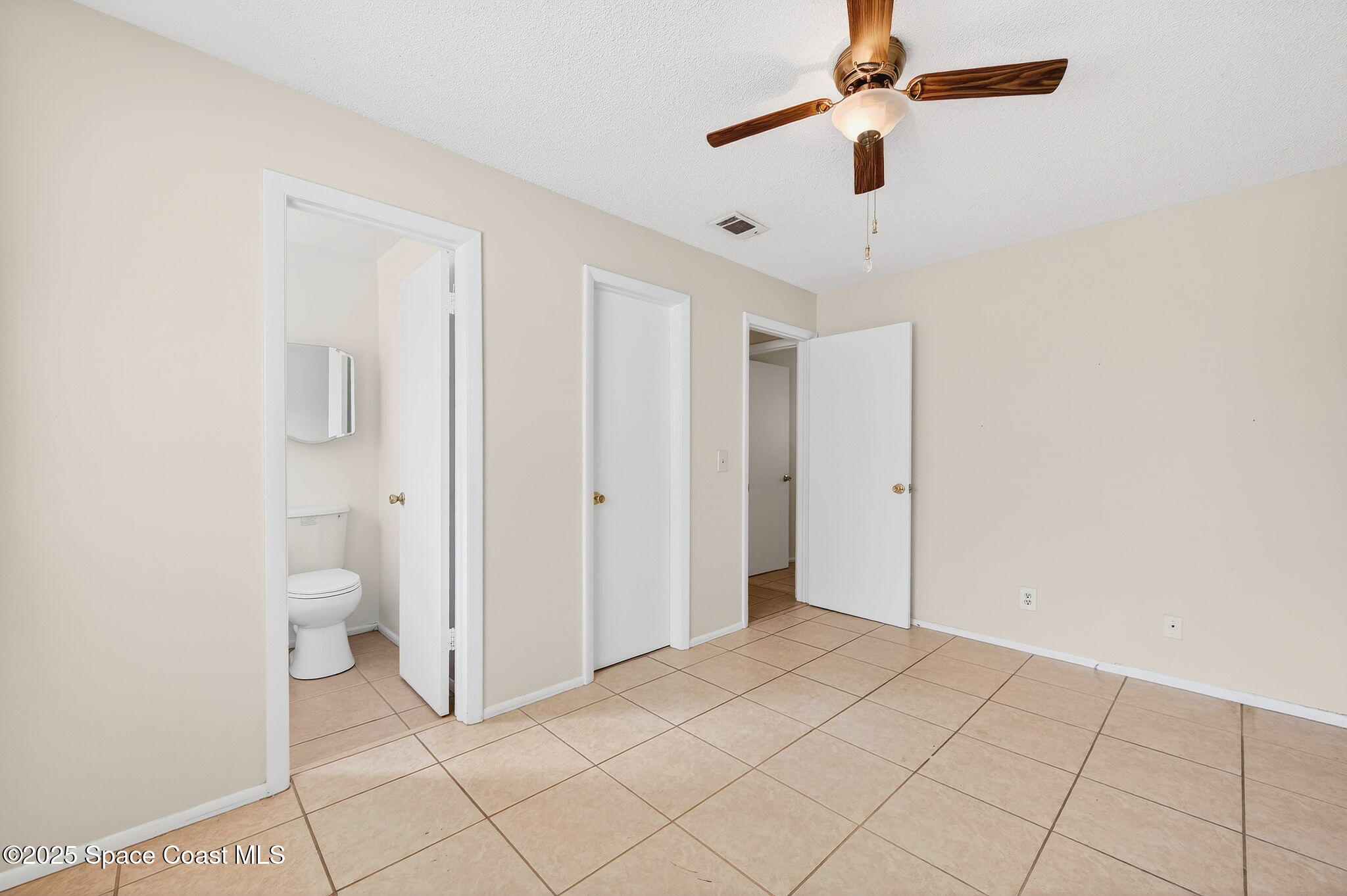 2135 Otterbein Avenue Cocoa, FL 32926 - Photo 17 of 28 a view of a bathroom with a shower and a toilet