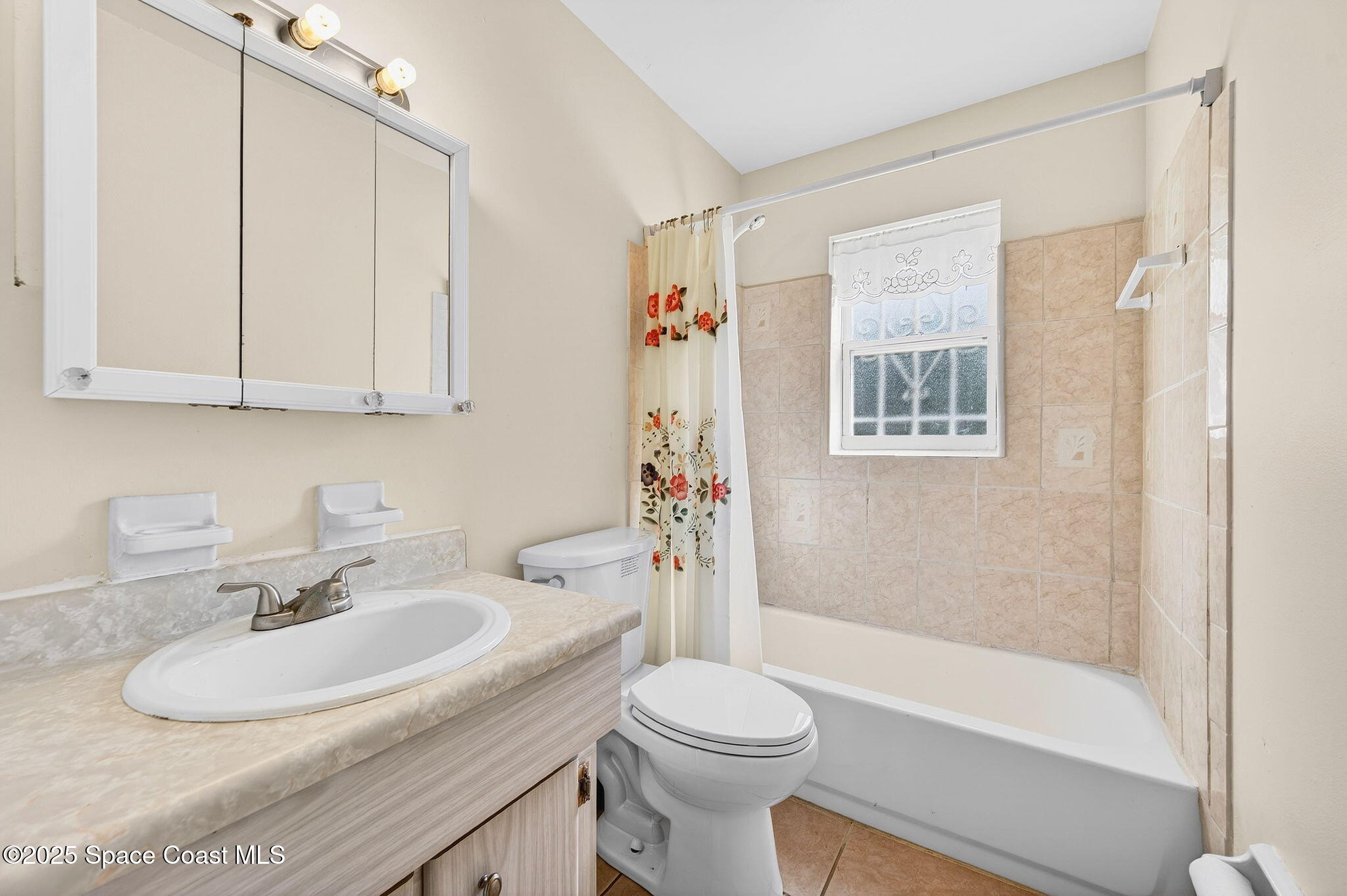 2135 Otterbein Avenue Cocoa, FL 32926 - Photo 22 of 28 a bathroom with a sink toilet and shower