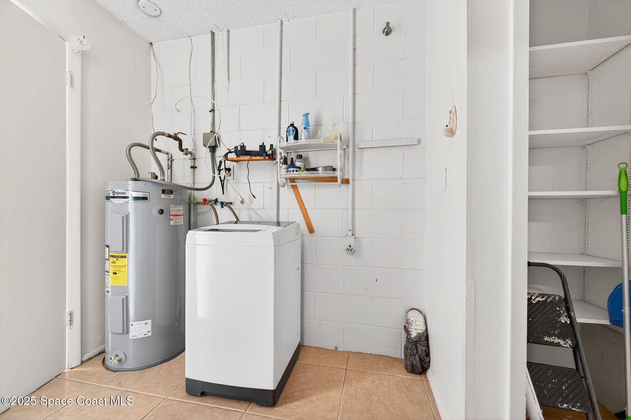 2135 Otterbein Avenue Cocoa, FL 32926 - Photo 23 of 28 a view of a room with gym equipment