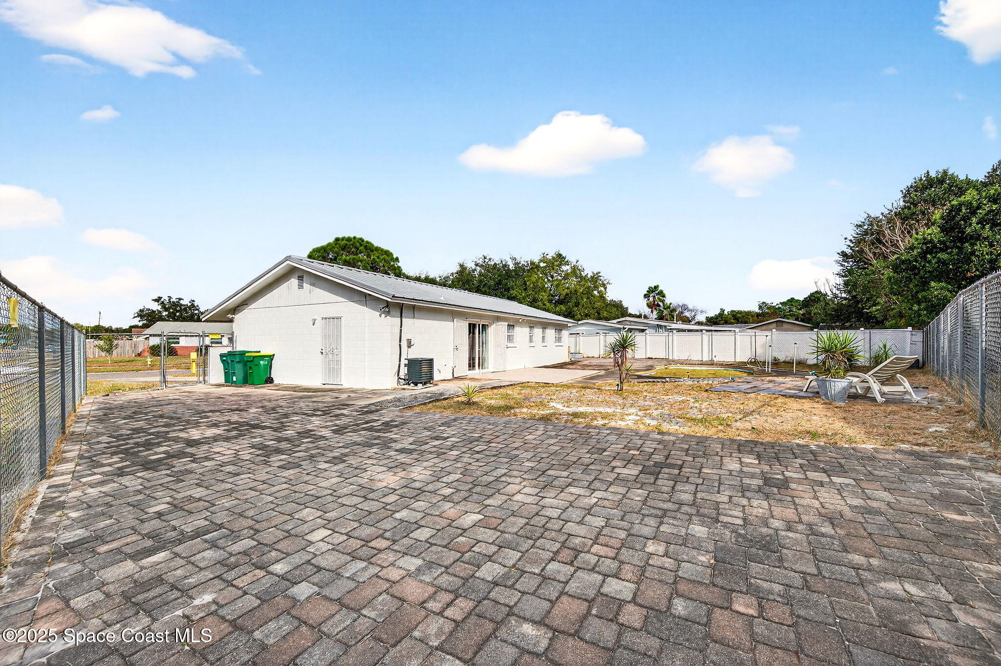 2135 Otterbein Avenue Cocoa, FL 32926 - Photo 27 of 28 a view of a house with a yard and lake view
