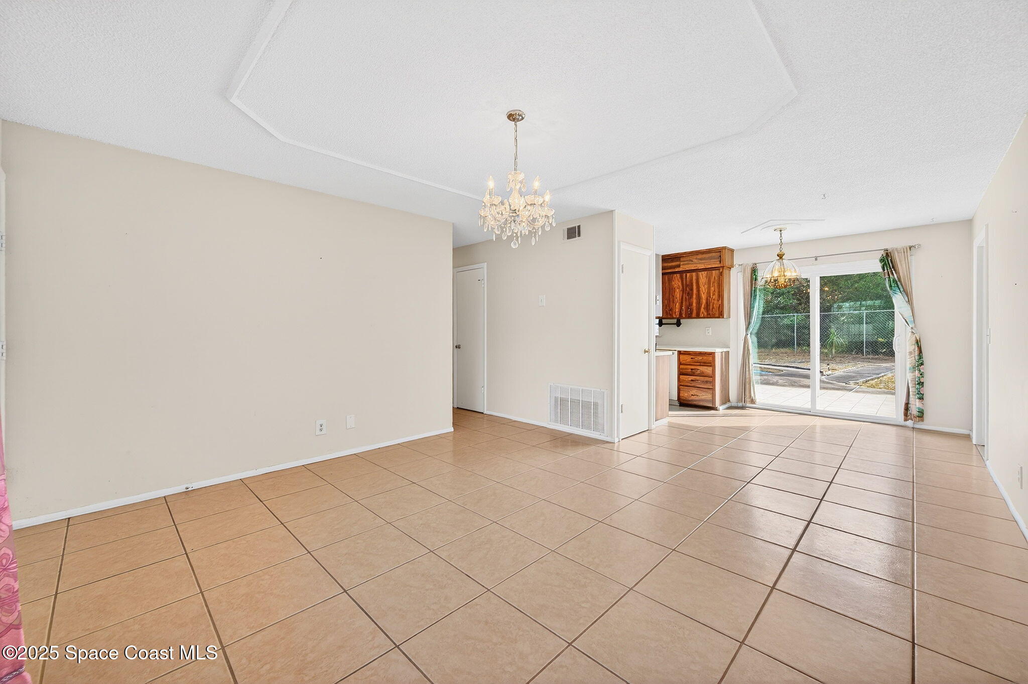 2135 Otterbein Avenue Cocoa, FL 32926 - Photo 9 of 28 a view of an empty room with a window