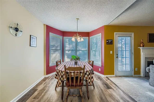 a dining room with furniture window wooden floor