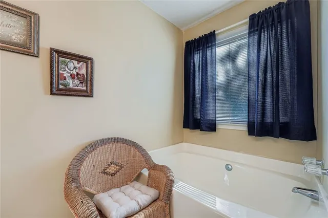 a bathroom with a tub and a sink