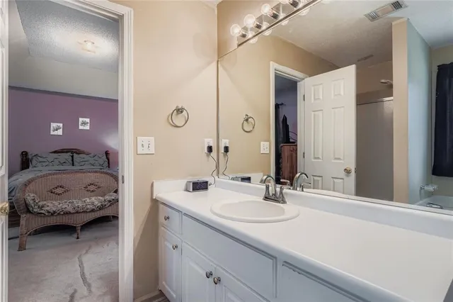 a en suite bathroom with a sink double vanity
