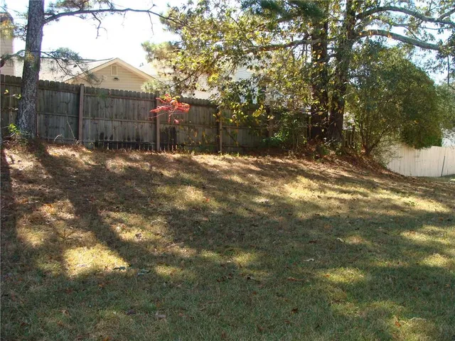 a view of a backyard of the house