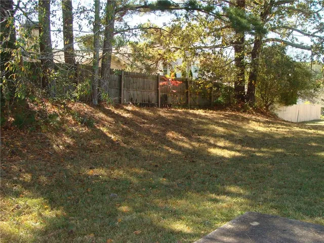 a backyard of a house with lots of green space