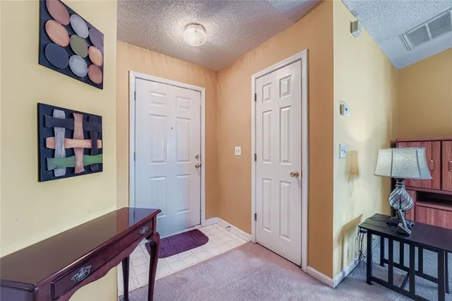 a view of a hallway with workspace