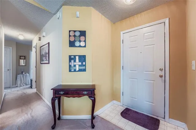 a bedroom with a bed and a mirror