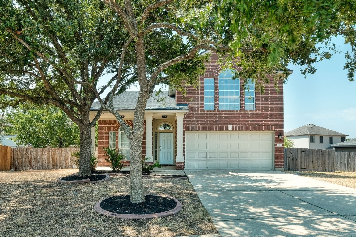 1003 Tom Seaver Place Round Rock, TX 78665 - Photo 1 of 1 a front view of a house with garden
