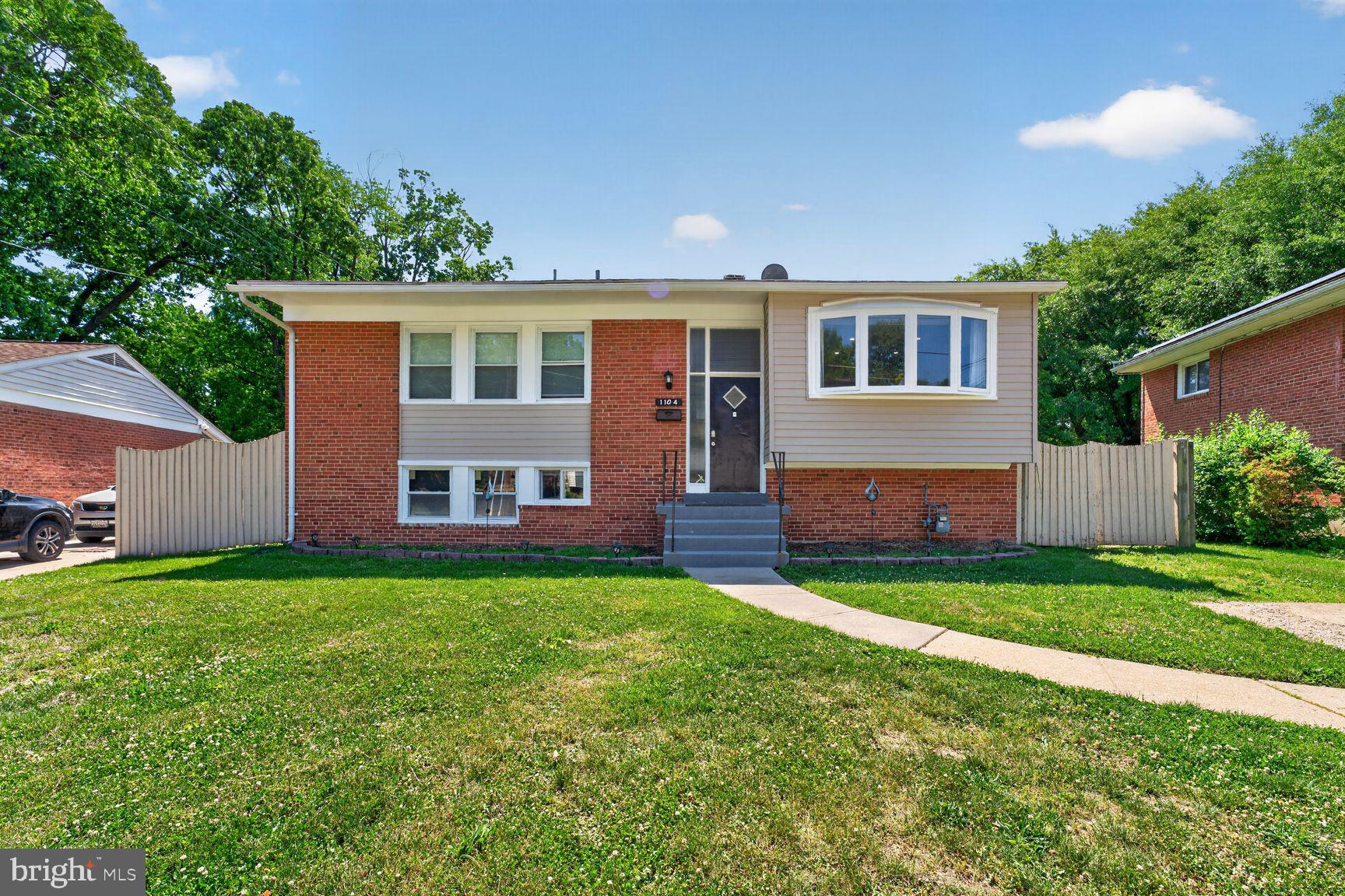 1104 Caddington Avenue Silver Spring, MD 20901 - Photo 2 of 35 a front view of house with yard and green space