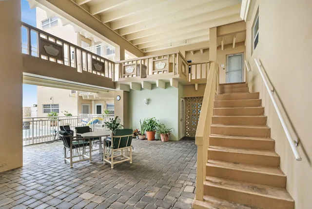 a view of a patio with couches table and chairs