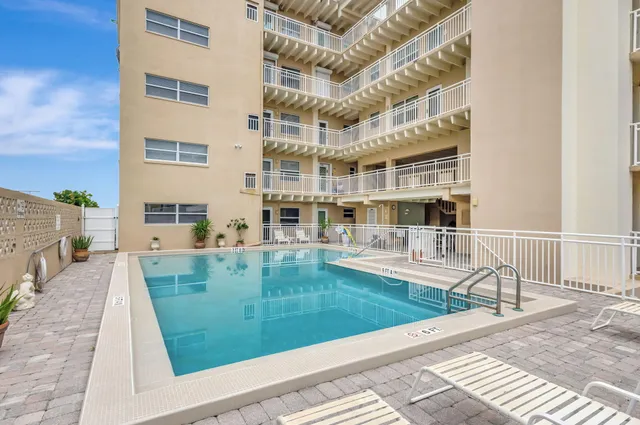 a view of a swimming pool with a patio