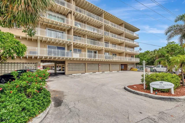 a front view of building with yard