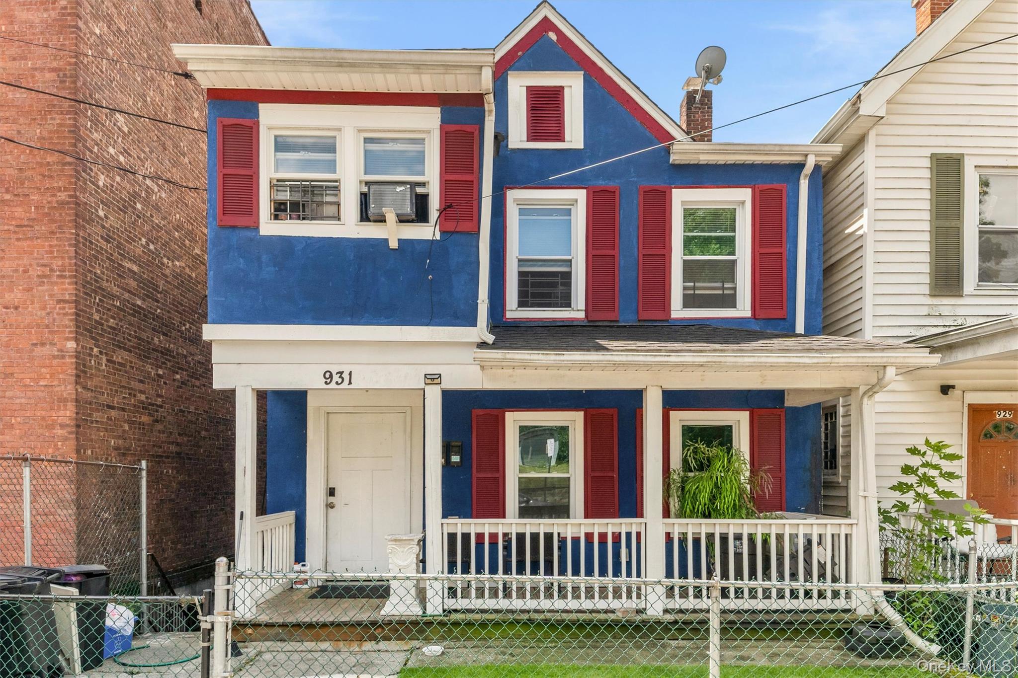 931 Diven Street Peekskill, NY 10566 - Photo 1 of 29 Two-story home with a blue facade and red shutters