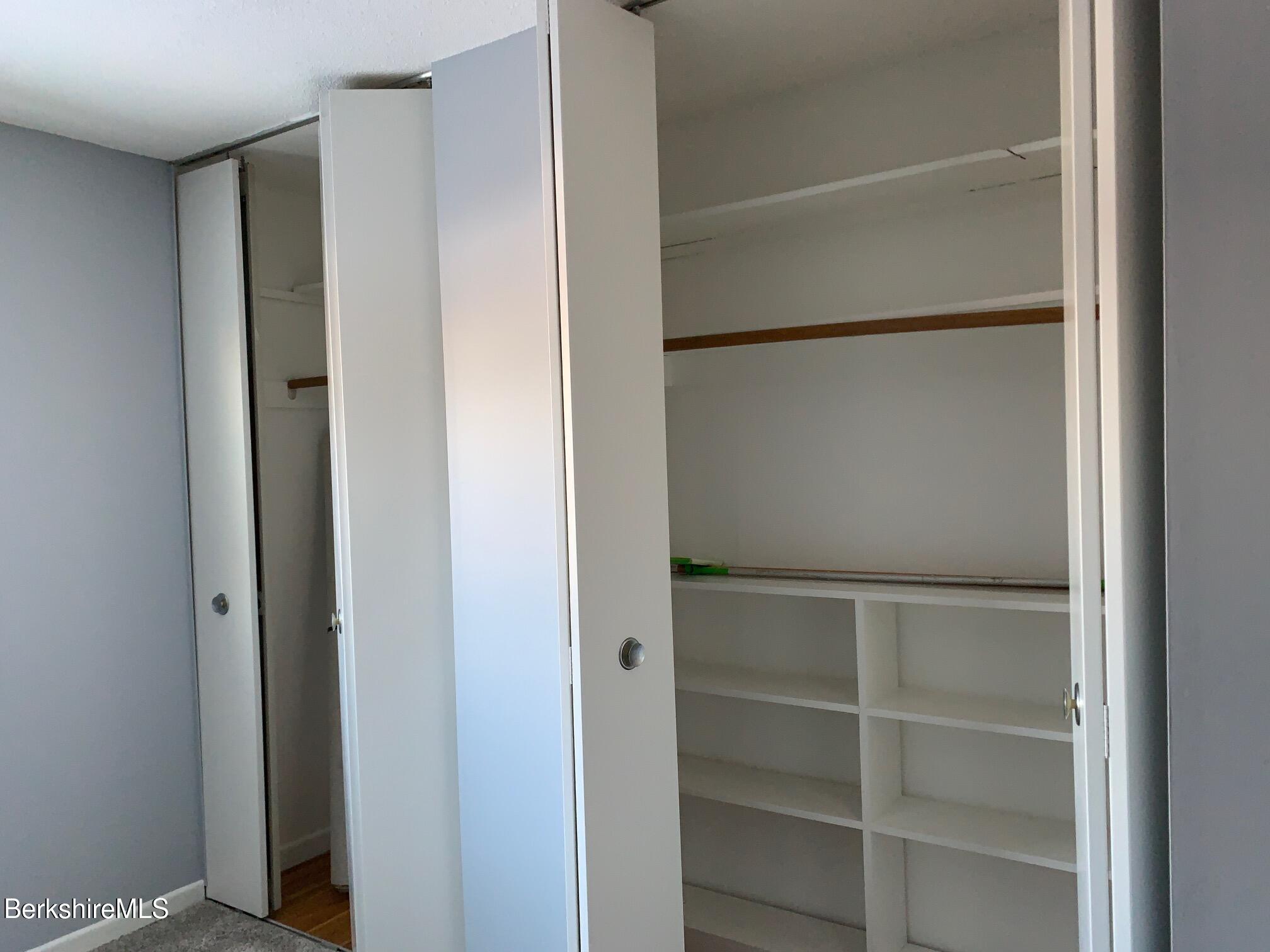 4 Morgan Manor, Unit 4 Lenox, MA 01240 - Photo 12 of 14 a view of walk in closet with empty racks