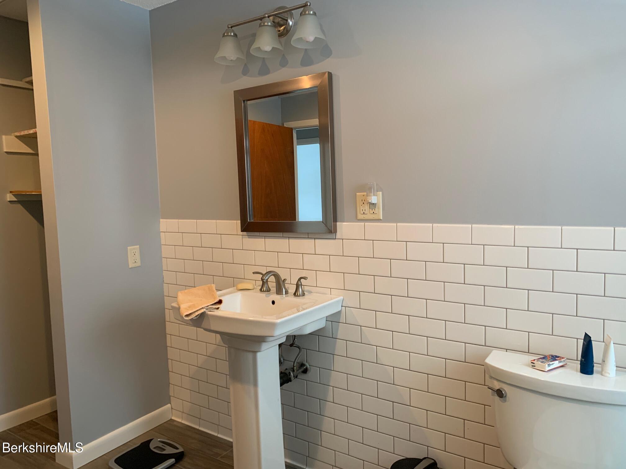 4 Morgan Manor, Unit 4 Lenox, MA 01240 - Photo 14 of 14 a bathroom with a sink and mirror