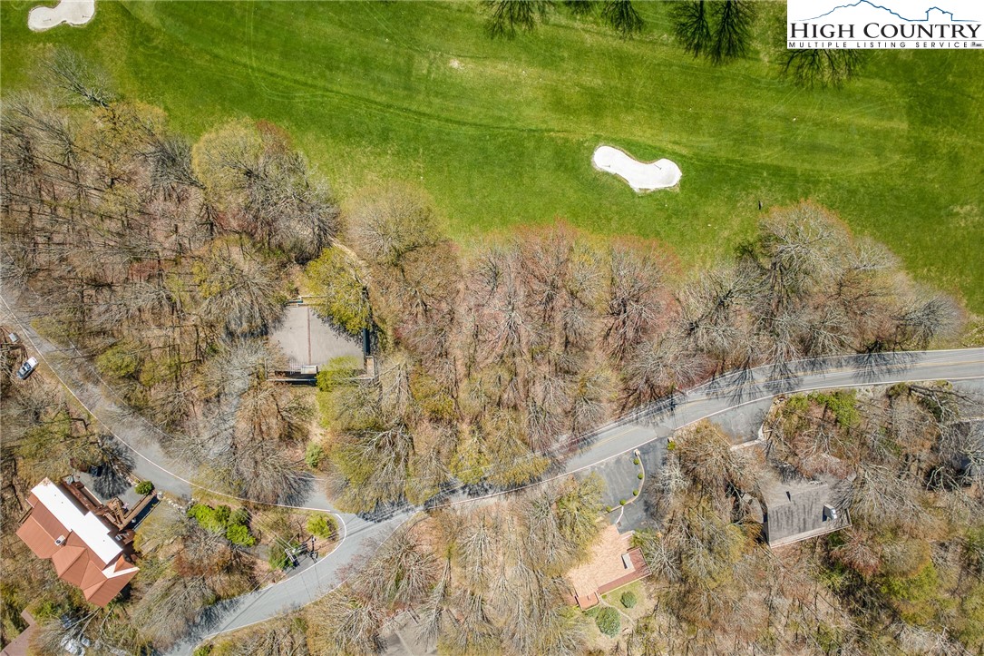 201 Grassy Gap Loop Road Beech Mountain, NC 28604 - Photo 15 of 16 a view of a lake with a yard