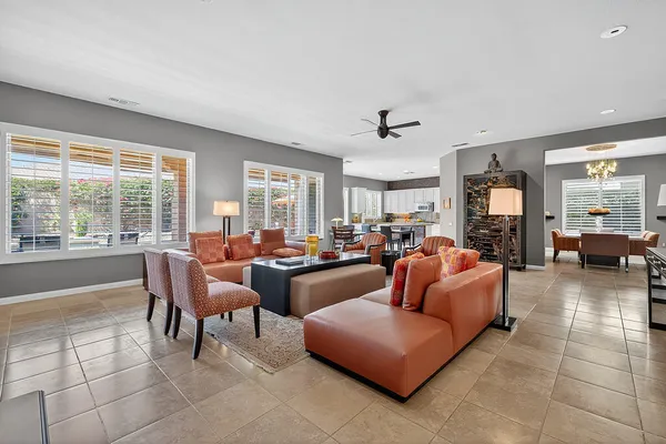 a living room with fireplace furniture and a flat screen tv