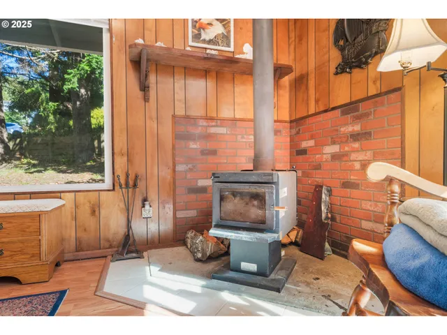 a living room with furniture a rug and a window