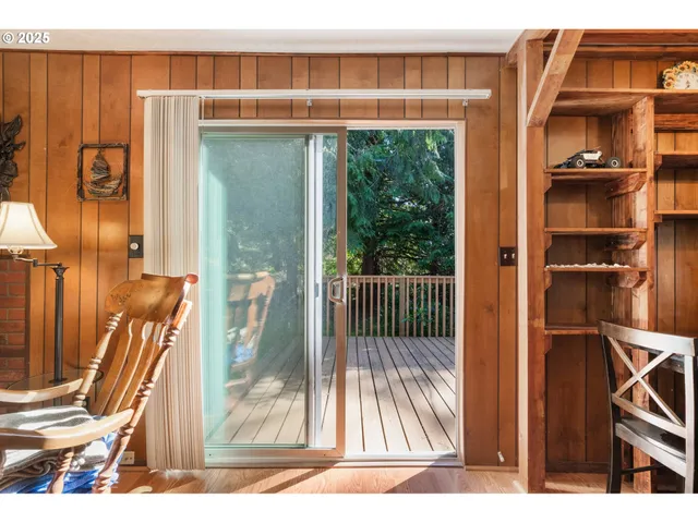 a view of a door and a living room