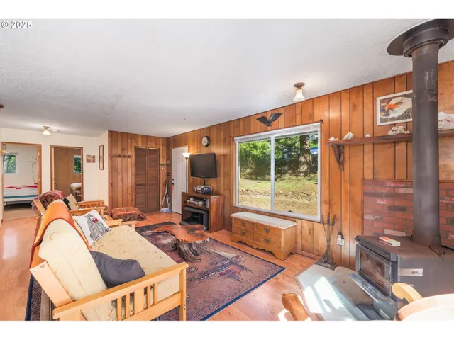 a living room with furniture and large windows