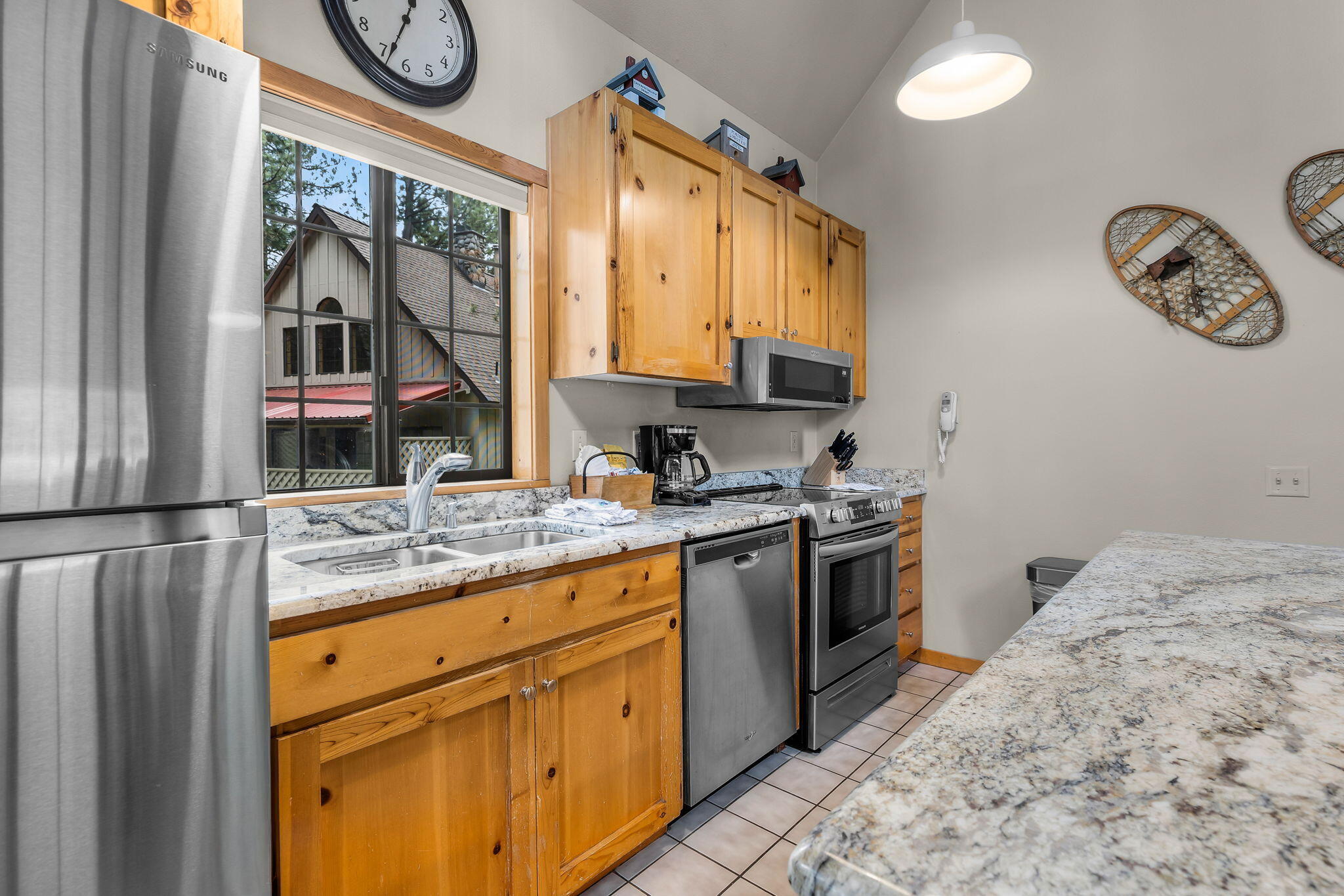 57505 Circle 4 Cabin Road, Unit 29 Sunriver, OR 97707 - Photo 16 of 35 a kitchen with stainless steel appliances granite countertop a stove and a sink