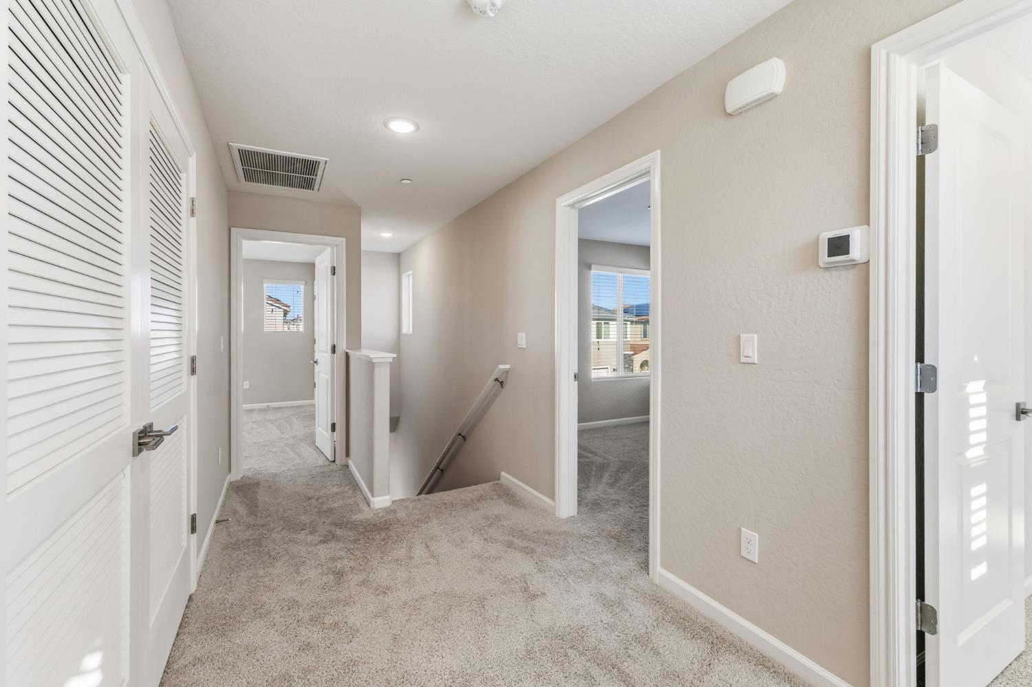 1116 Elevations Way West Madera, CA 93636 - Photo 14 of 35 wooden view of a hallway with two rooms
