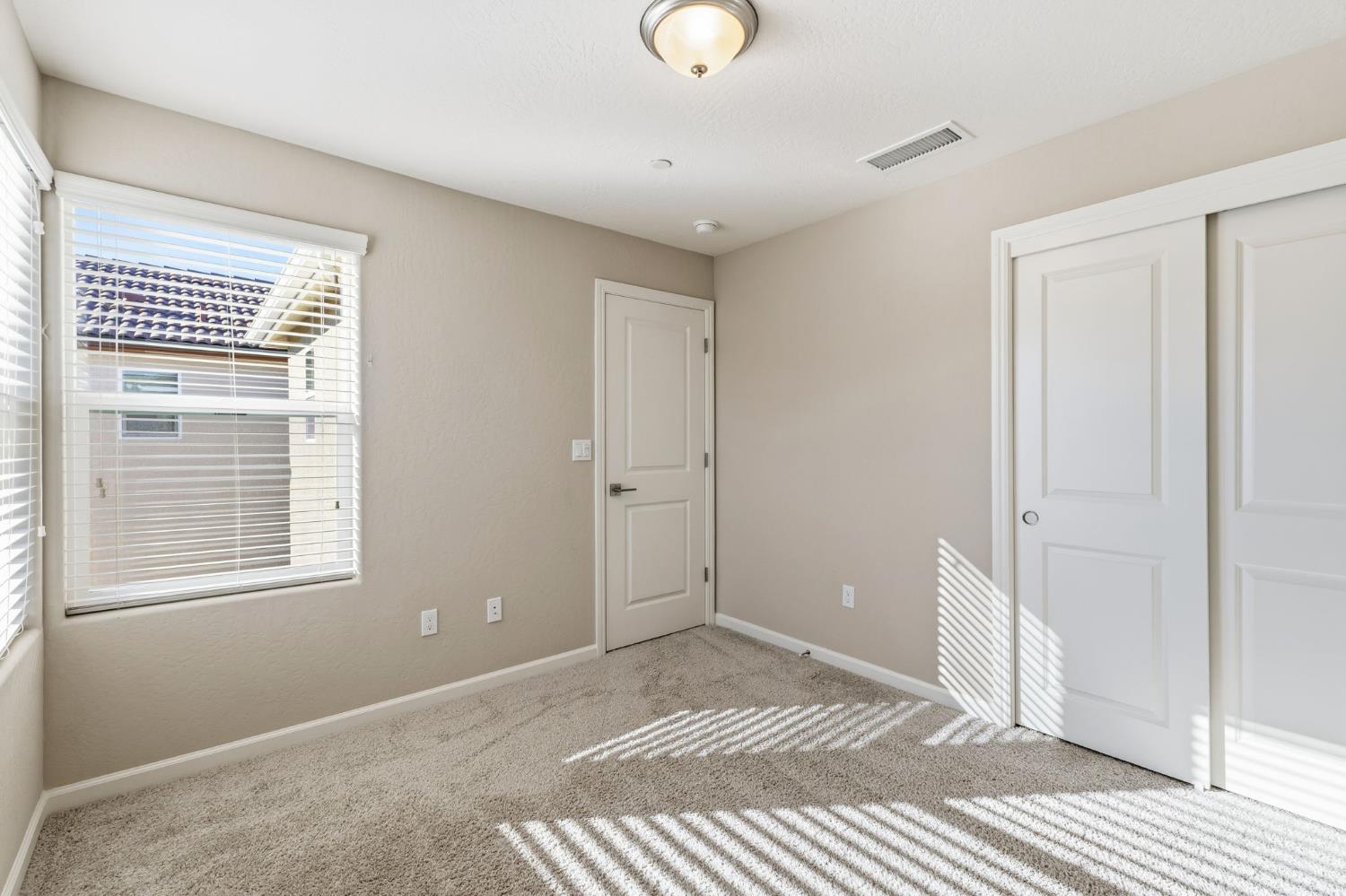 1116 Elevations Way West Madera, CA 93636 - Photo 16 of 35 a view of a livingroom with a windows