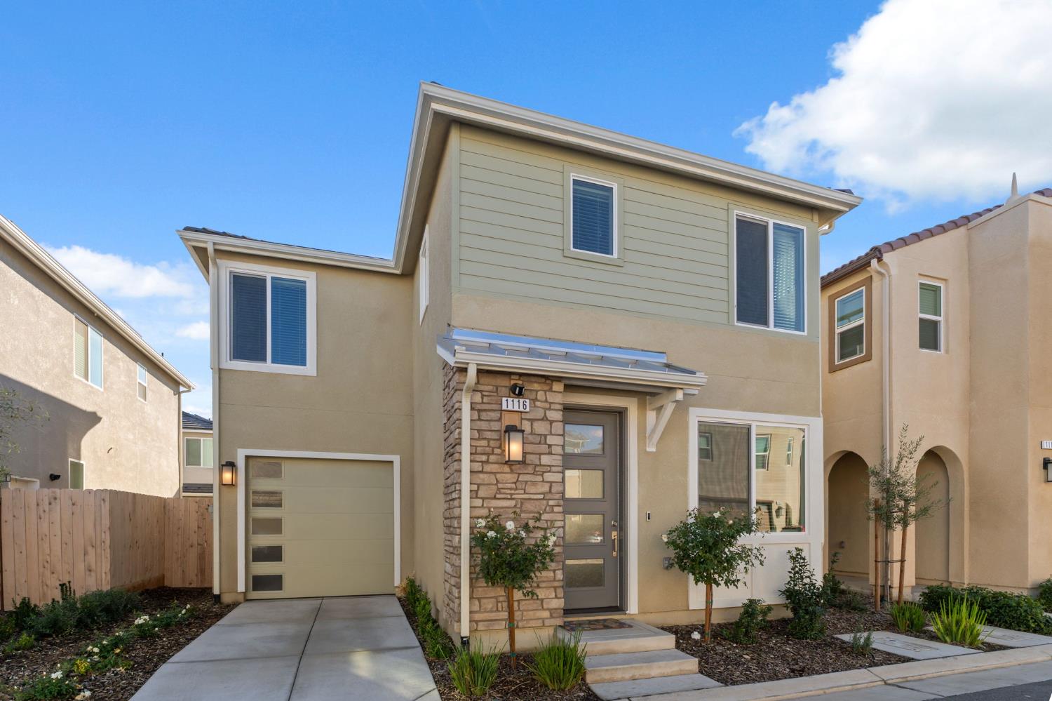 1116 Elevations Way West Madera, CA 93636 - Photo 3 of 35 a front view of a house with garden