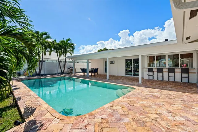 a view of a house with swimming pool