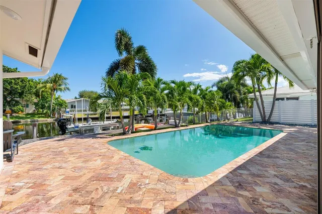 a view of a swimming pool with a lounge chairs