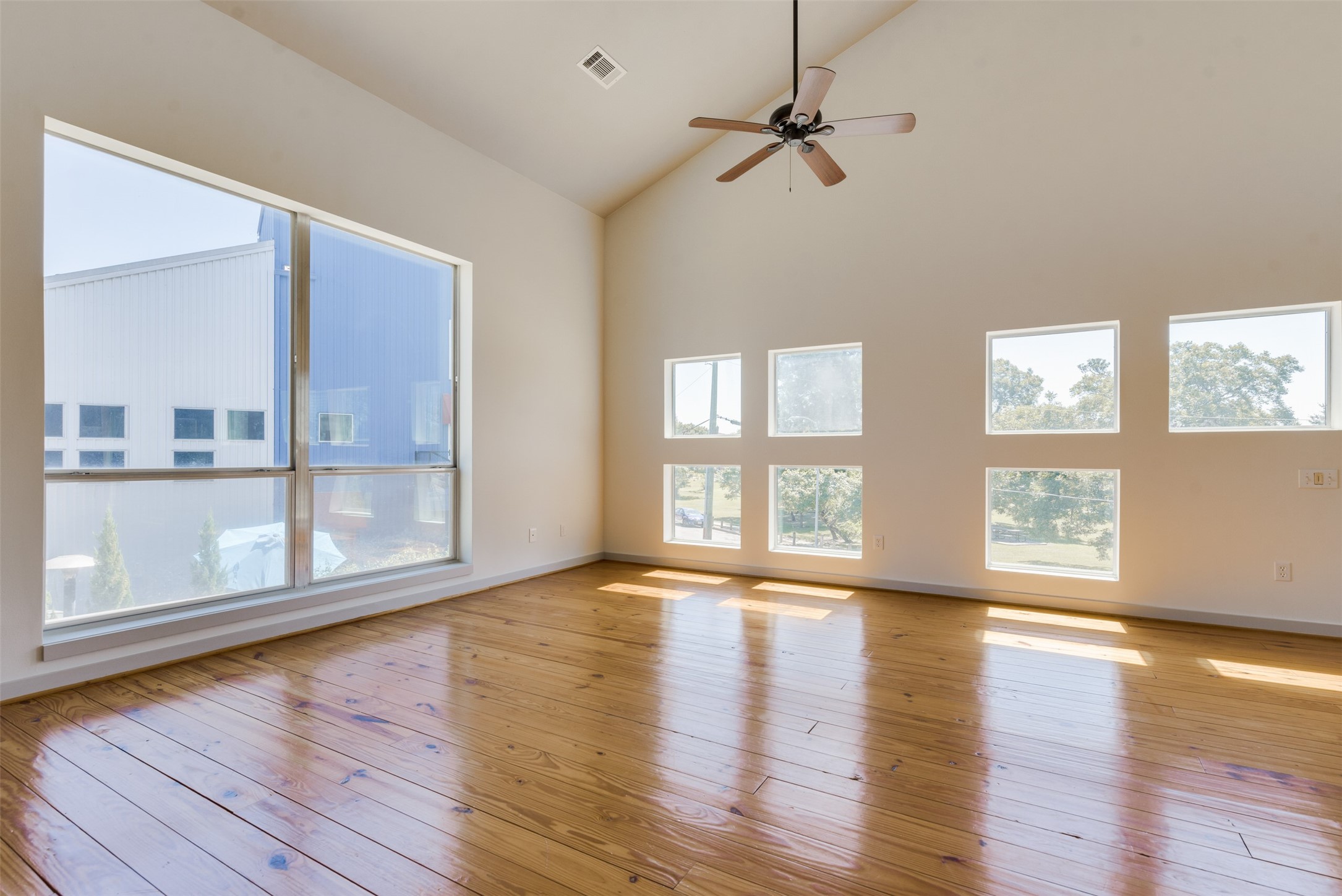 2605 Calumet Street, Unit 48 Houston, TX 77004 - Photo 27 of 34 a view of an empty room with wooden floor and a window
