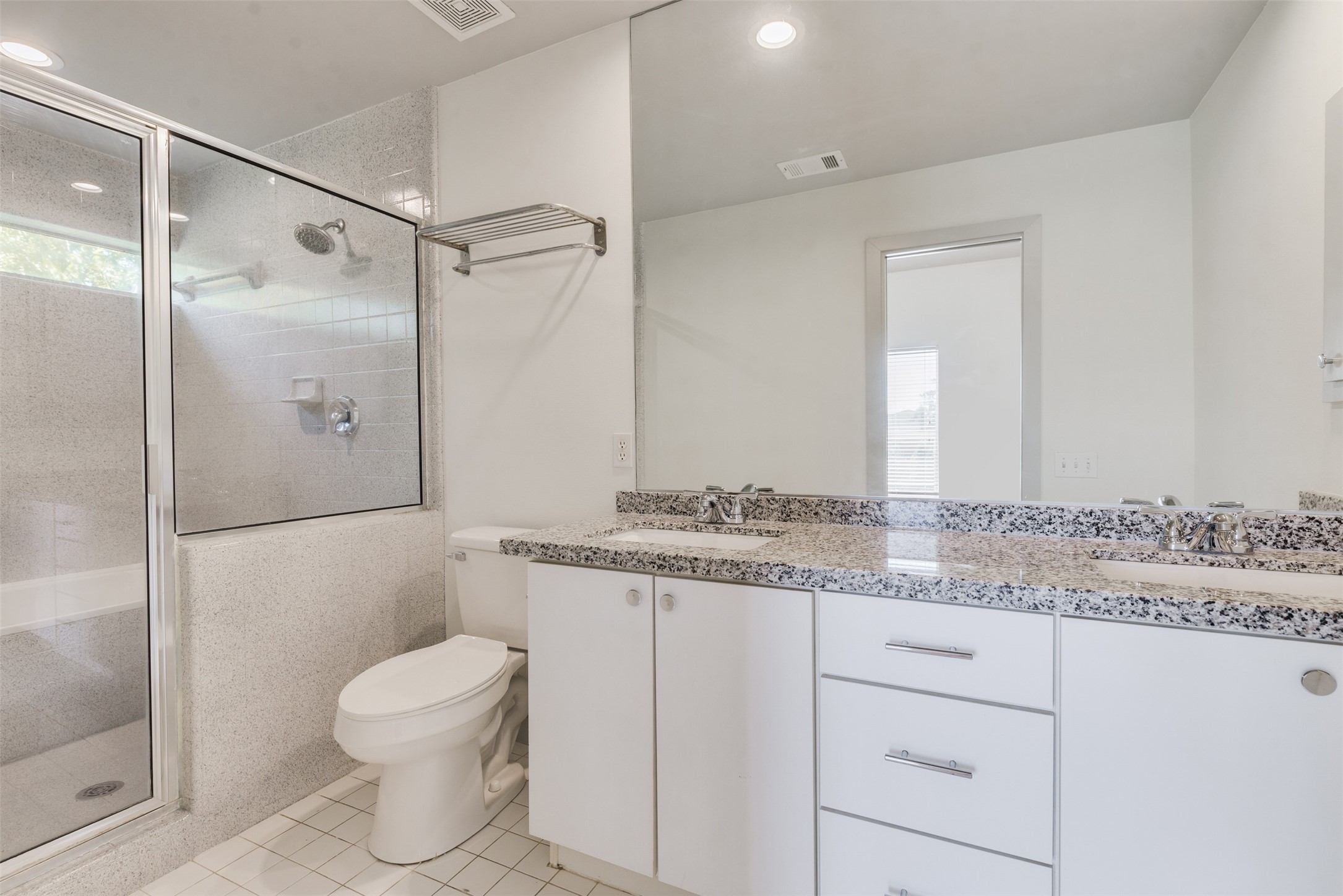 2605 Calumet Street, Unit 48 Houston, TX 77004 - Photo 30 of 34 a bathroom with a granite countertop sink toilet and shower
