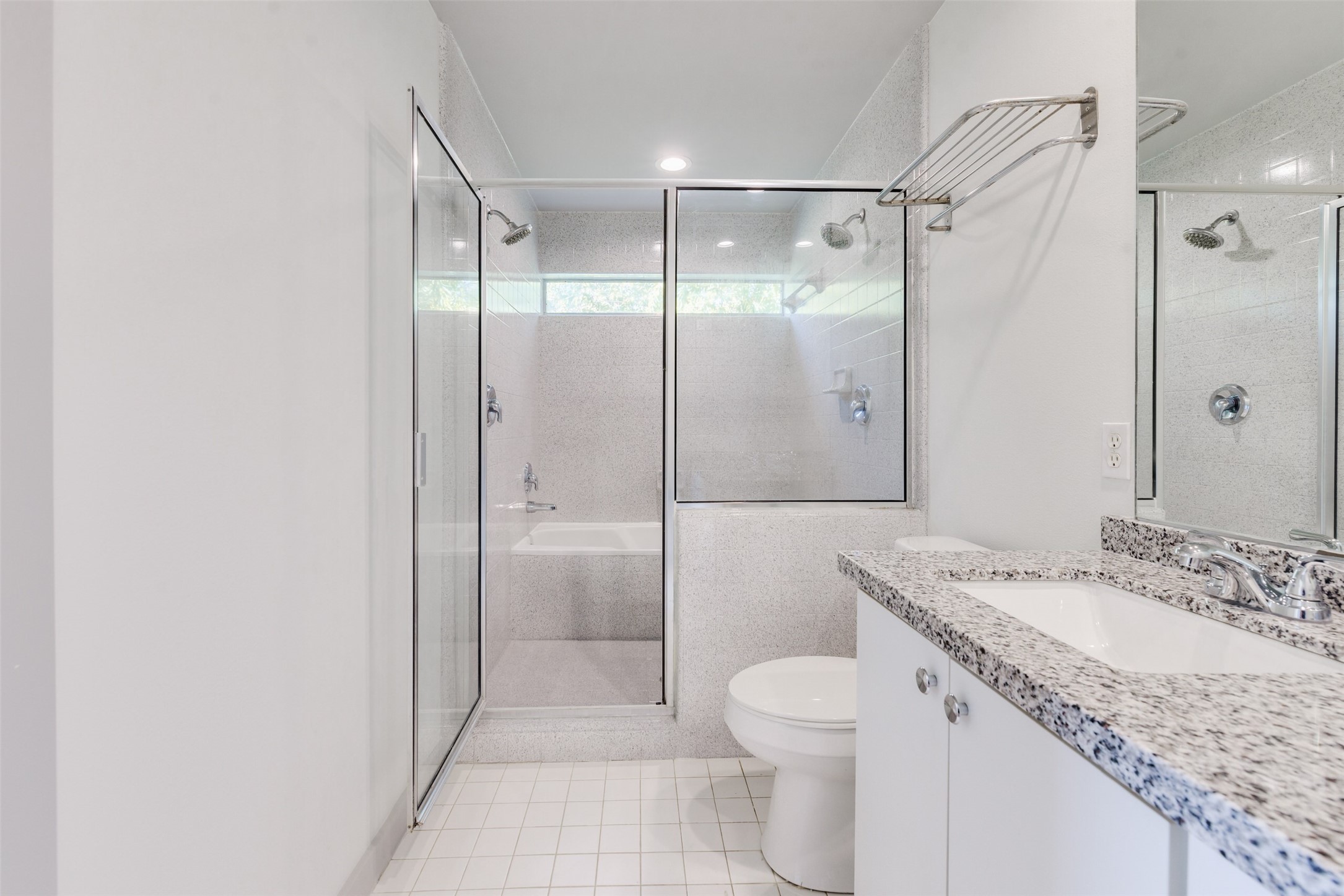 2605 Calumet Street, Unit 48 Houston, TX 77004 - Photo 31 of 34 a bathroom with a granite countertop sink toilet and shower