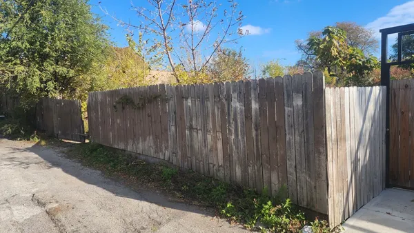 a view of a wooden fence