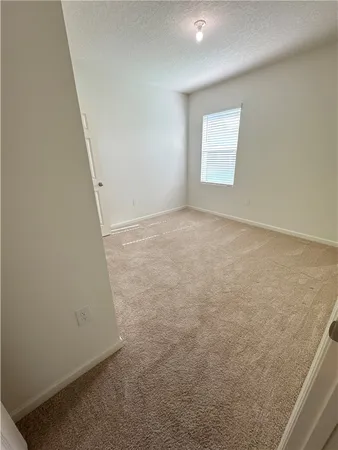 an empty room with a staircase