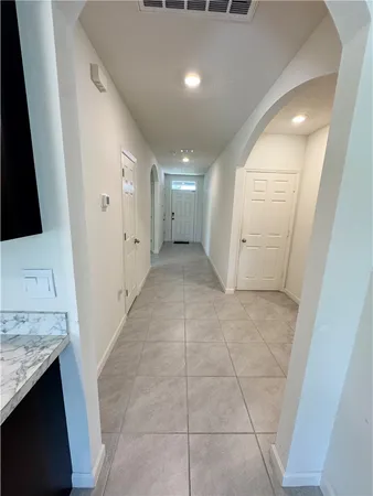 a view of kitchen with stainless steel appliances cabinets
