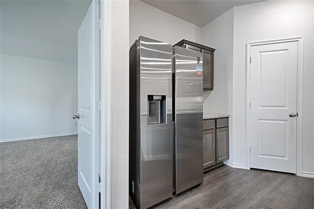 a kitchen with stainless steel appliances granite countertop a stove a microwave and a sink