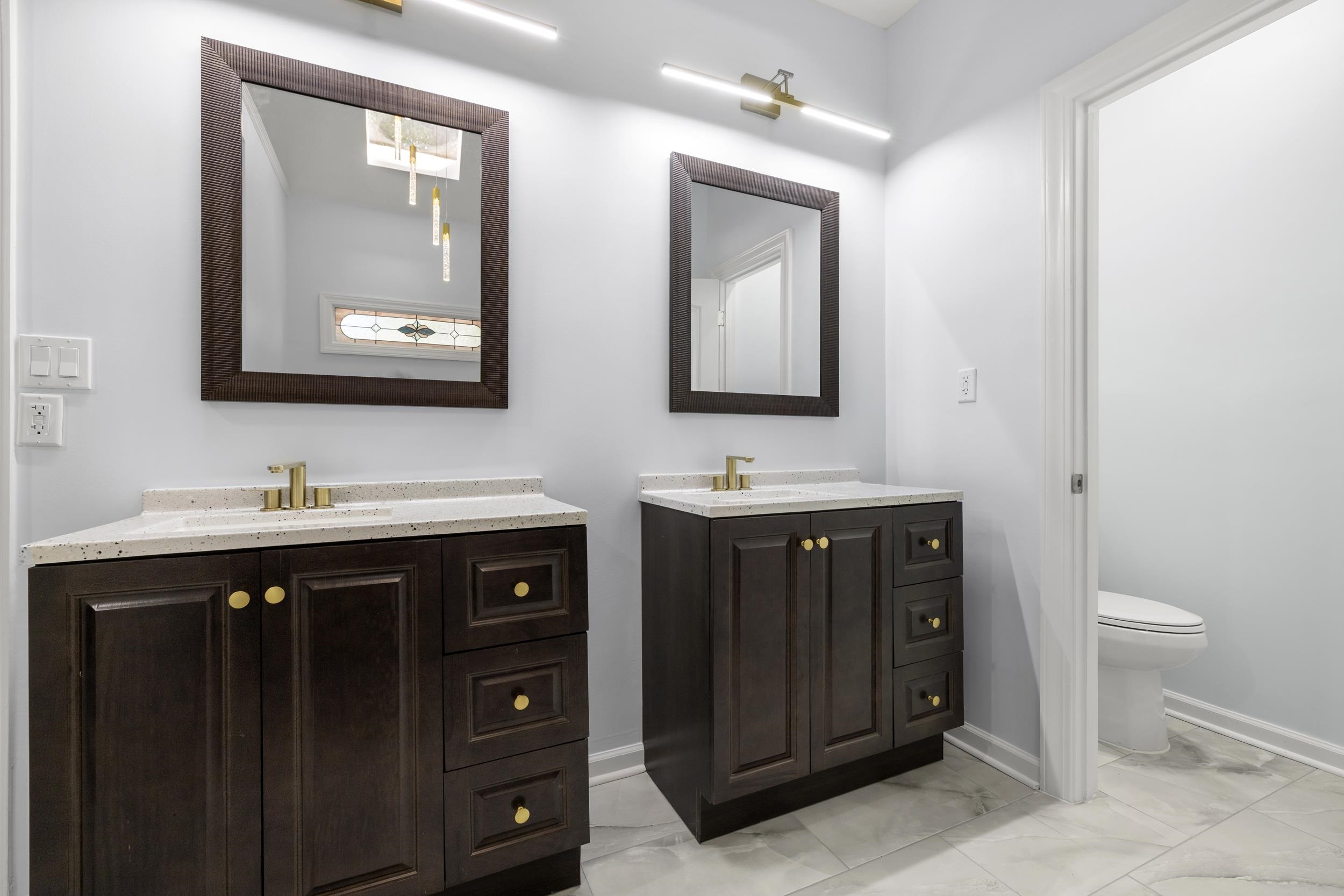486 Brook Ridge Circle Memphis, TN 38018 - Photo 32 of 40 Full bathroom featuring light marble finish floors and two vanities