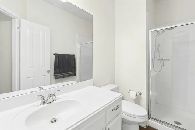 a view of an empty room with a ceiling fan