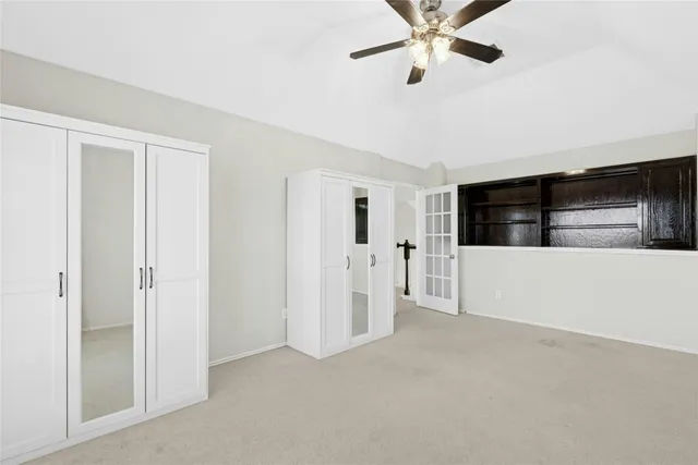 a bathroom with a granite countertop sink a mirror and a shower
