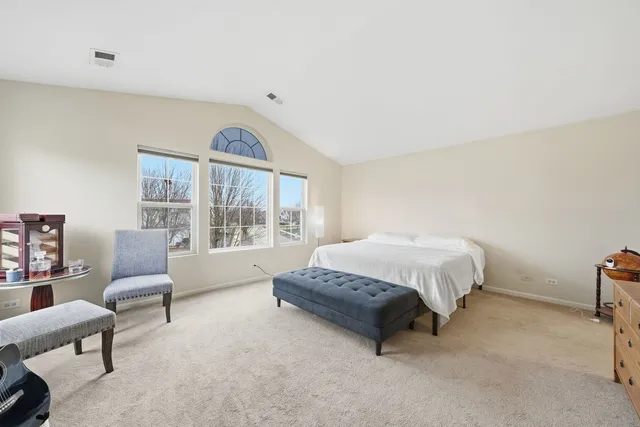 a bathroom with a bathtub sink and mirror