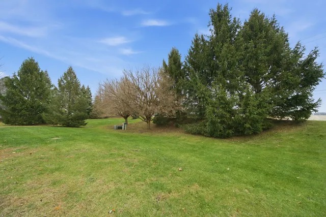 a view of a patio with table and chairs potted plants with wooden floor