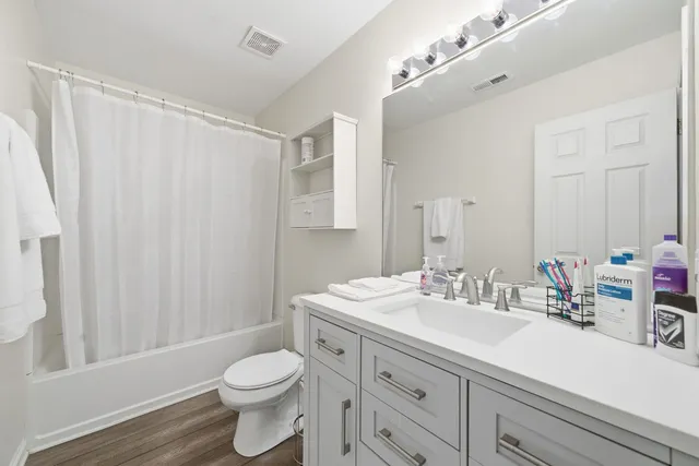 a bedroom with bed and window