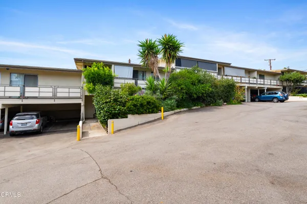 a view of a car park in front of house