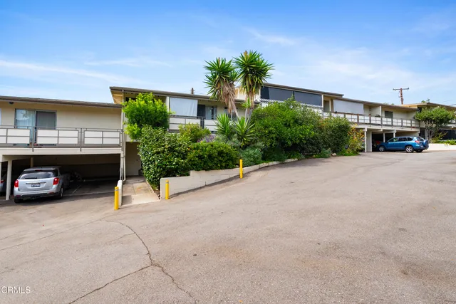 a view of a car park in front of house