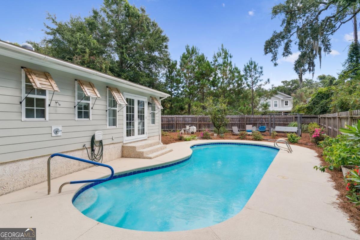 311 Dunbarton Drive St. Simons, GA 31522 - Photo 11 of 44 a view of a house with swimming pool