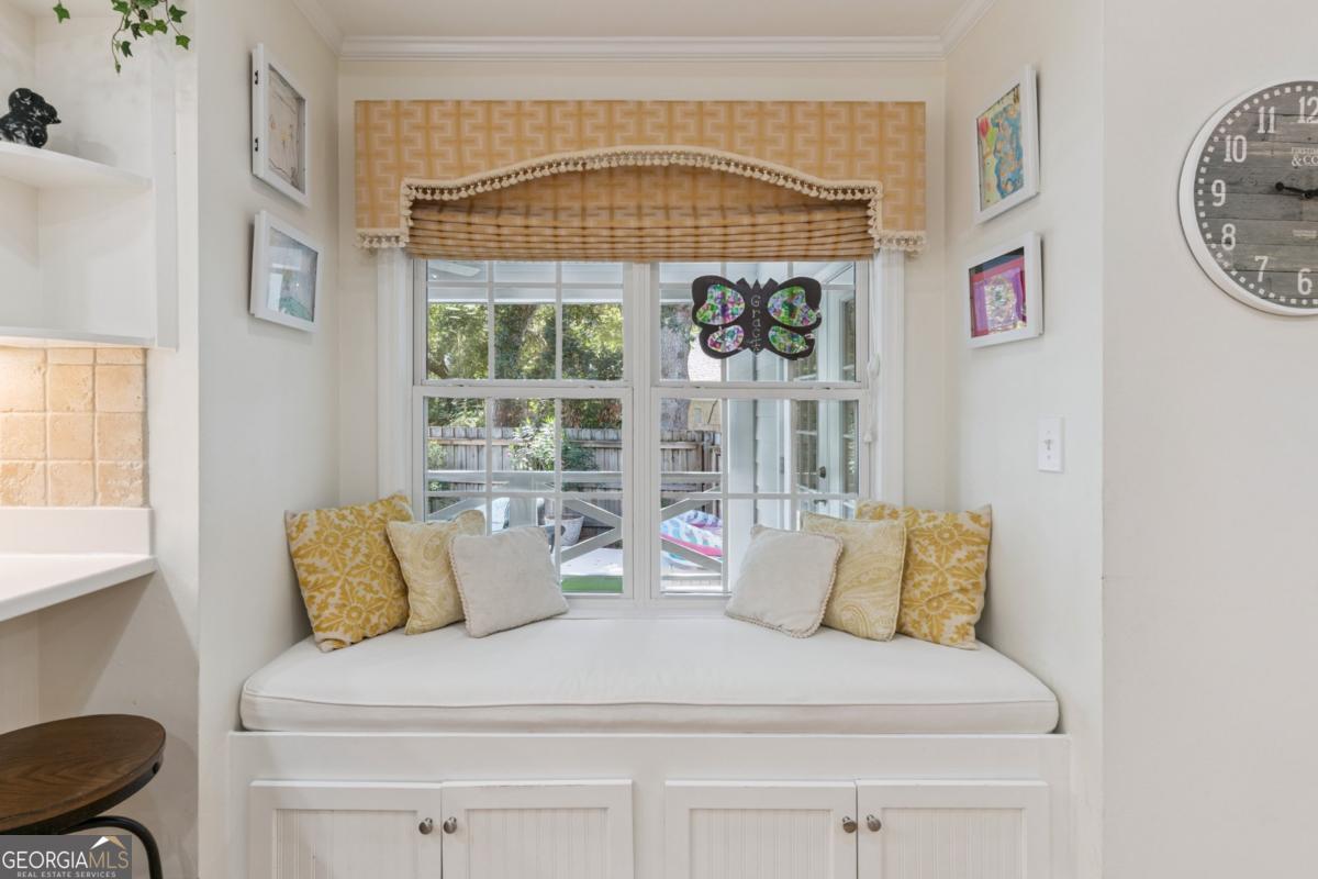 311 Dunbarton Drive St. Simons, GA 31522 - Photo 21 of 44 a bedroom with a bed and a window